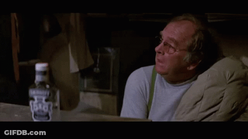 Bottle Of Jack Daniel's Next To Man GIF