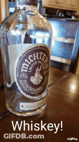 Bottle Of Whiskey Next To Chair GIF