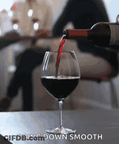 Bottle Of Wine Being Poured Into Glass Going Down Smooth GIF