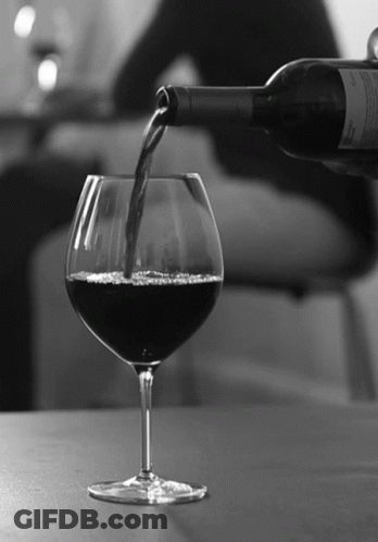 Bottle Of Wine Poured Into Wine Glass GIF