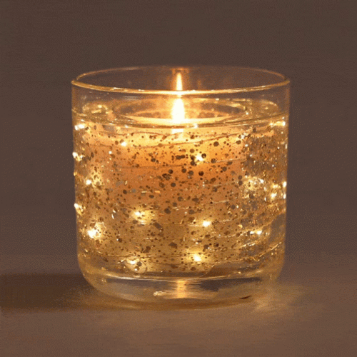 Bougie Floating In Glitter GIF