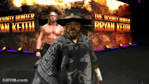 Bounty Hunter Bryan Keith In Front Of Fire GIF