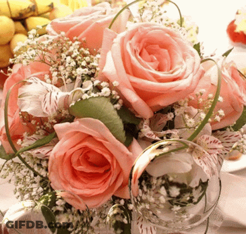 Bouquet Of Pink Roses With Baby's Breath And Greenery GIF