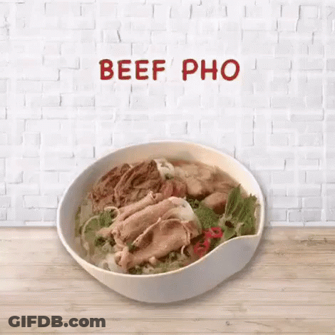 Bowl Of Beef Pho On Wooden Table GIF