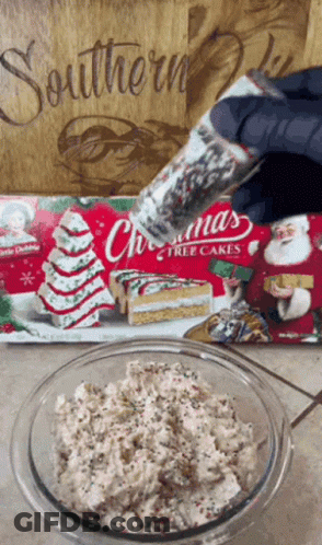 Bowl Of Christmas Tree Cakes Next To Package GIF