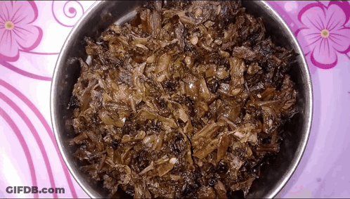 Bowl Of Food On Table With Purple Flowers GIF