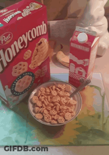 Bowl Of Honeycomb Cereal Next To Box GIF
