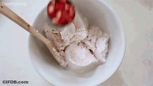 Bowl Of Ice Cream Stirred With Wooden Spoon Country Living GIF