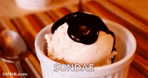 Bowl Of Ice Cream With Chocolate Sauce Pouring GIF