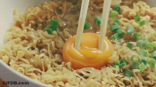 Bowl Of Noodles With Broken Egg And Chopsticks GIF