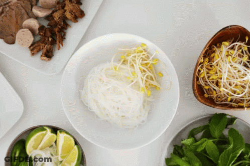 Bowl Of Noodles With Sprouts And Limes GIF