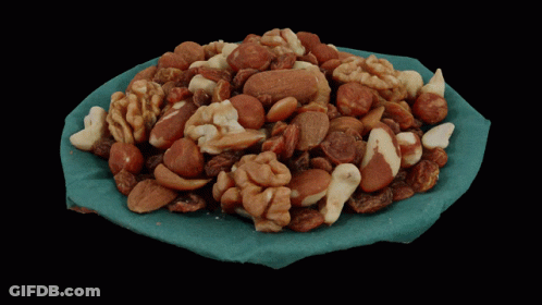 Bowl Of Nuts On Blue Cloth GIF