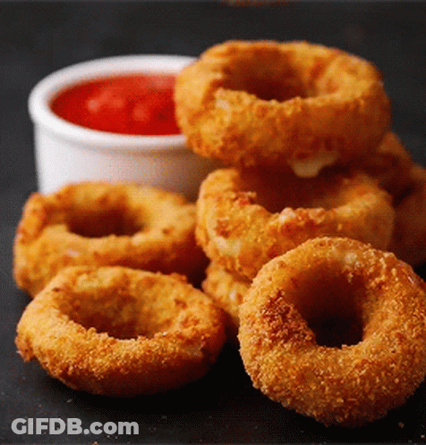 Bowl Of Onion Rings Next To Ketchup GIF