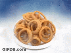 Bowl Of Onion Rings On Blue Background GIF