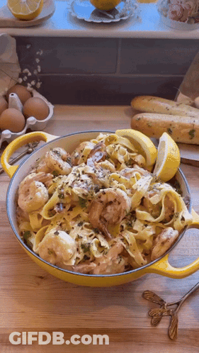 Bowl Of Pasta With Shrimp And Lemon Slices GIF