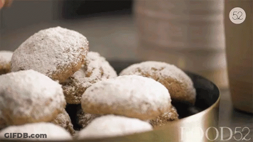 Bowl Of Powdered Sugar Cookies With Number 52 GIF