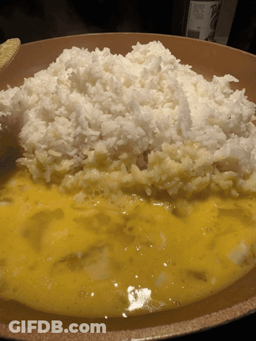 Bowl Of Rice With Yellow Sauce And Wine GIF