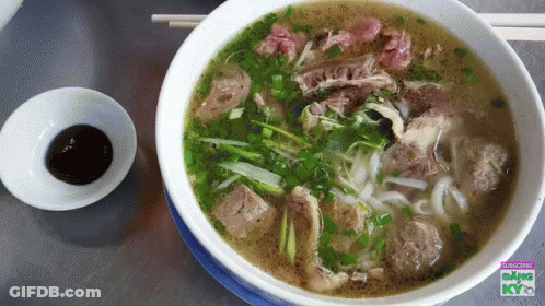 Bowl Of Soup With Chopsticks And Dipping Sauce Saying Kyo GIF