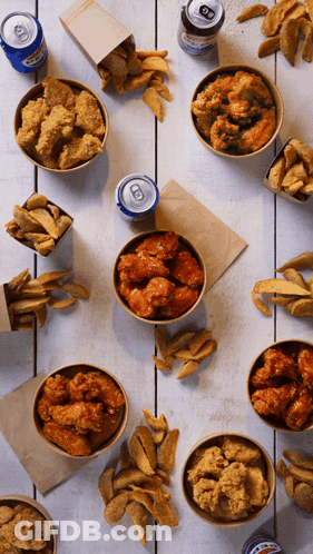 Bowls Of Fried Chicken And French Fries On A Table With A Can Of Pepsi GIF