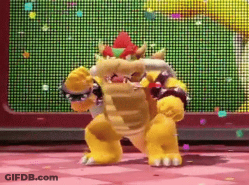 Bowser Is Dancing In Front Of A Screen With Confetti Falling From It . GIF