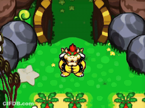 Bowser Is Standing In A Grassy Area In A Video Game . GIF