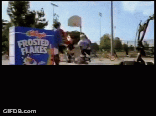 Box Of Frosted Flakes Next To Cereal Bowl GIF