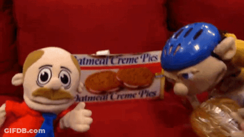 Box Of Oatmeal Creme Pies On Red Surface GIF