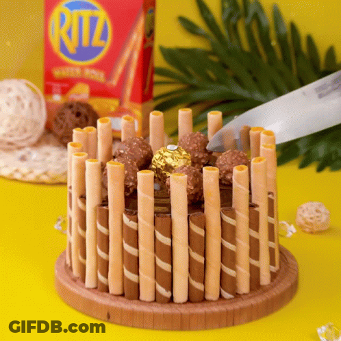 Box Of Ritz Wafer Sticks On Yellow Table GIF