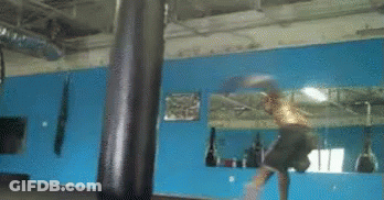Boxer Hitting Punching Bag In Front Of Mirror GIF