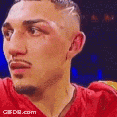 Boxer In Red Shirt Looking At Camera GIF
