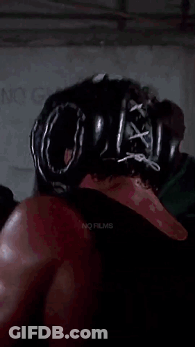 Boxer With Helmet And Gloves Fighting Another GIF