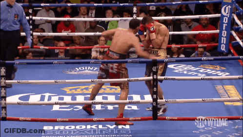 Boxers Fighting In Ring With Corona Ads GIF