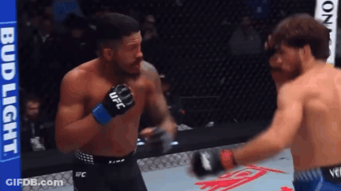 Boxers Fighting In Ring With UFC Glove GIF