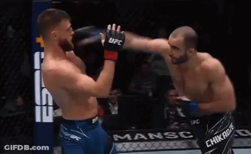 Boxers Fighting In Ring With UFC Gloves GIF