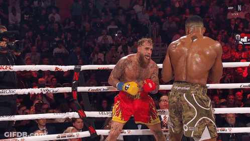 Boxers In Ring One Wearing Home Team Shorts GIF