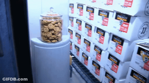 Boxes Of French Bread Are Stacked On Top Of Each Other In A Store GIF
