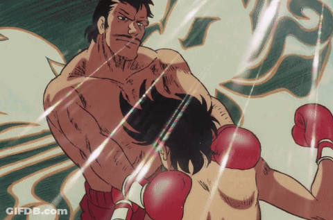 Boxing Match Between Two Men With Red Gloves GIF
