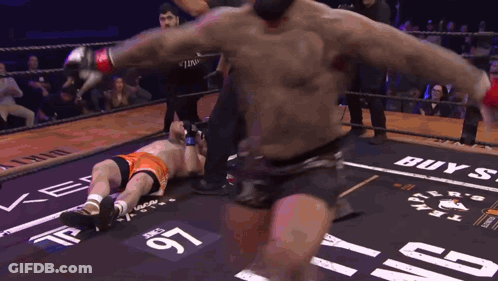 Boxing Match In Ring Saying Buy GIF