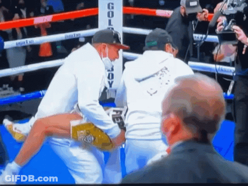 Boxing Ring With Gold Body Sign GIF