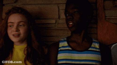 Boy And Girl Holding Microphones Saying Build GIF