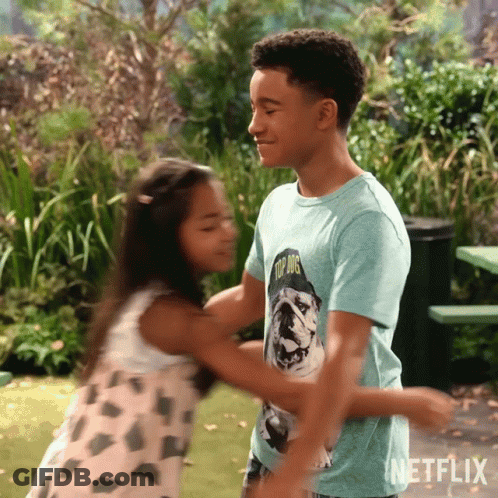 Boy And Girl Hugging Boy In Top Dog Shirt GIF