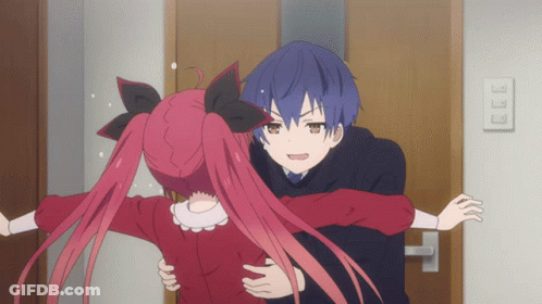 Boy And Girl Hugging In Front Of Door GIF