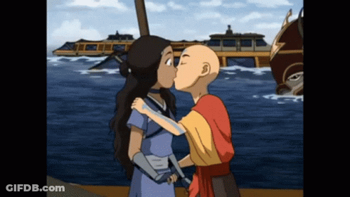 Boy And Girl Kissing In Front Of Boat GIF