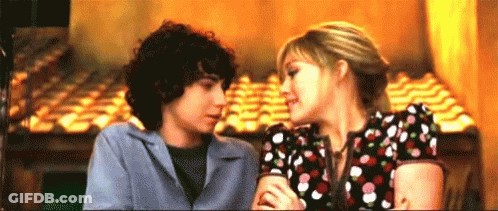 Boy And Girl Kissing In Restaurant GIF