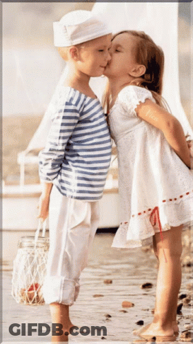 Boy And Girl Kissing On Beach GIF