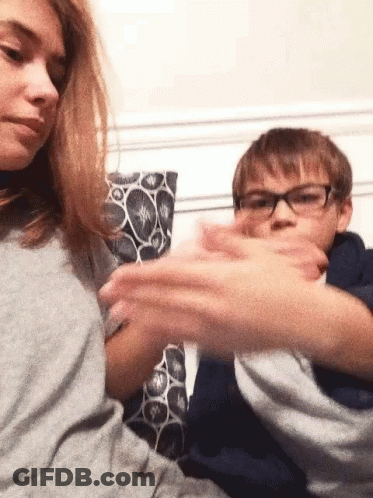 Boy And Girl Playing On Couch GIF