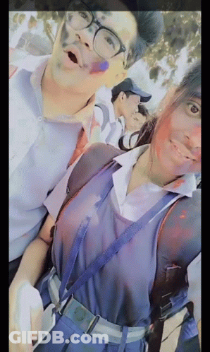 Boy And Girl Posing With Holi Colors GIF