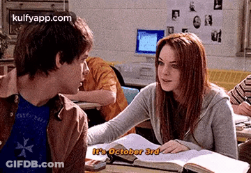 Boy And Girl Sitting At Desk Girl Talking To Boy GIF