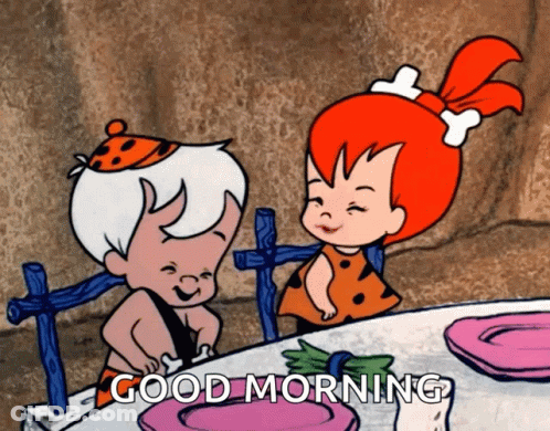 Boy And Girl Sitting At Table Saying Good Morning GIF