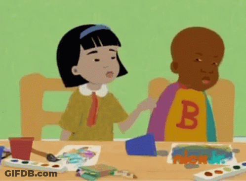 Boy And Girl Sitting At Table GIF